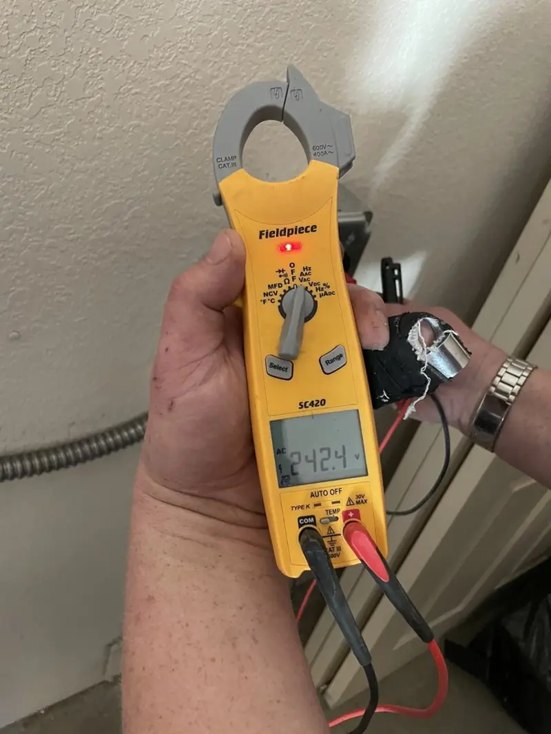 Voltage testing with clamp meter during Aluminum Wiring Replacement in Reidsville